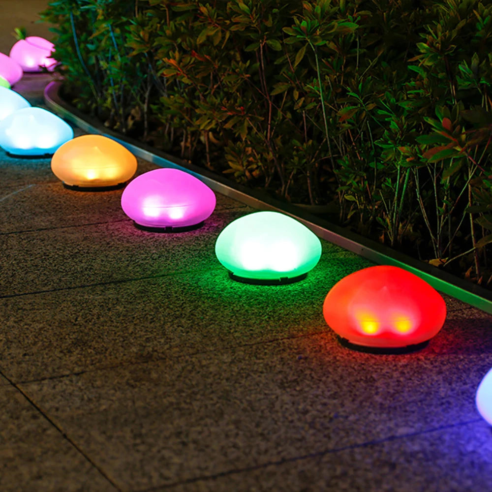 Routa - Solar-Gartenleuchte im Kieselstein-Design aus Glas