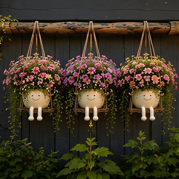 Florawipp – Schwingstuhl-Blumentopf mit Smiley-Detail