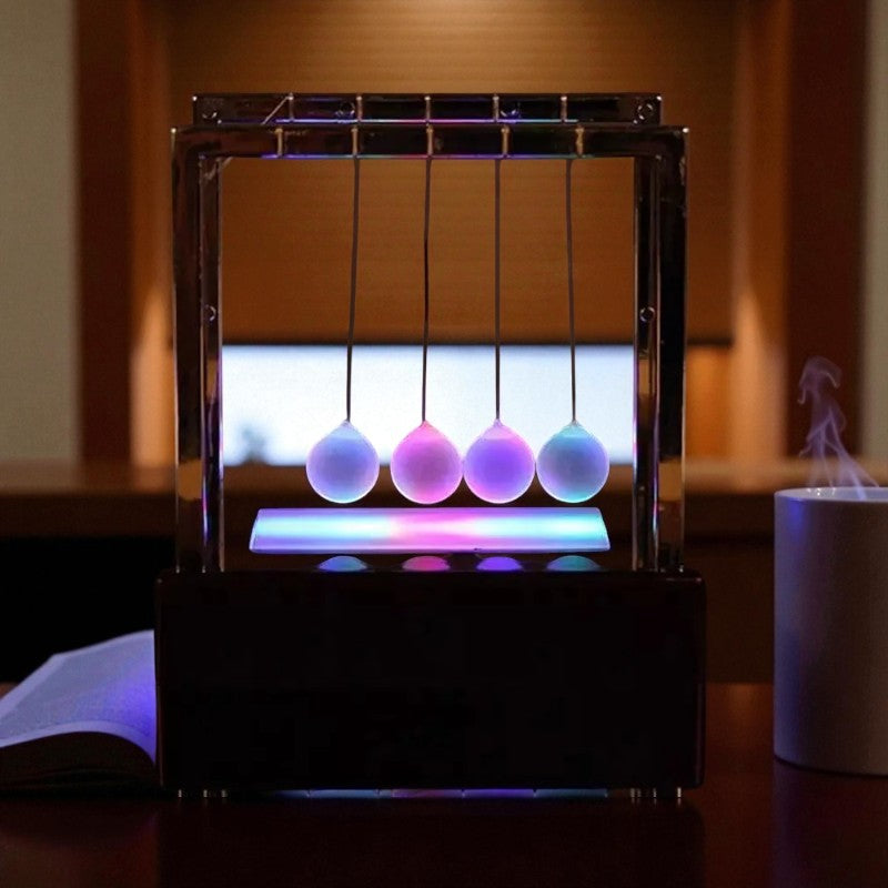 LED-Newton-Pendel für hypnotische Bewegung und Lichtspiel