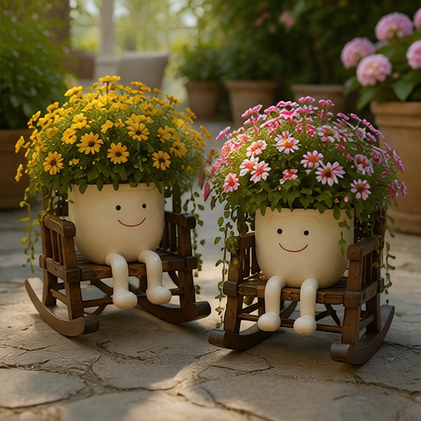 Florawipp – Schwingstuhl-Blumentopf mit Smiley-Detail
