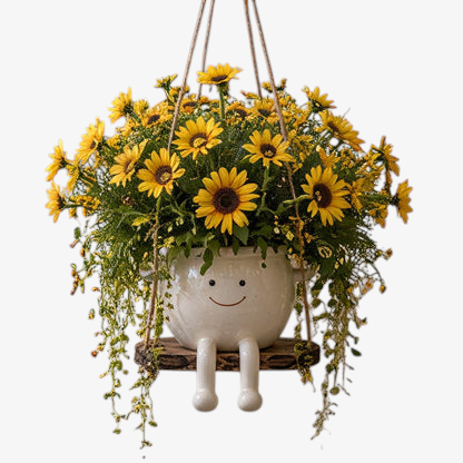 Florawipp – Schwingstuhl-Blumentopf mit Smiley-Detail