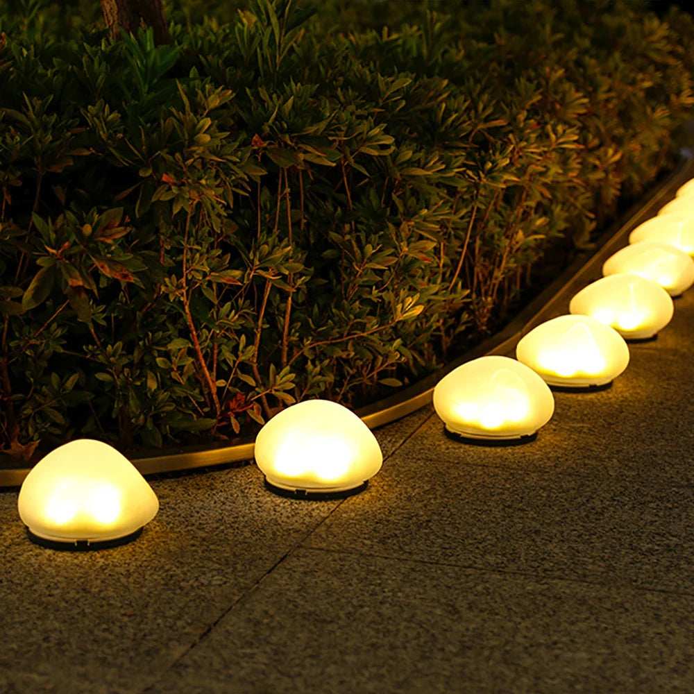 Routa - Solar-Gartenleuchte im Kieselstein-Design aus Glas